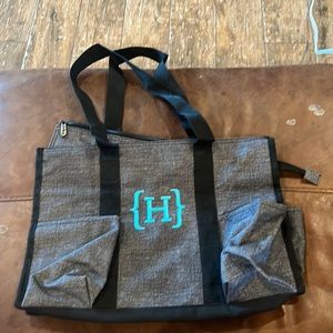 Thirty One “diaper” bag letter H on front 7 outside pockets no inside pockets
